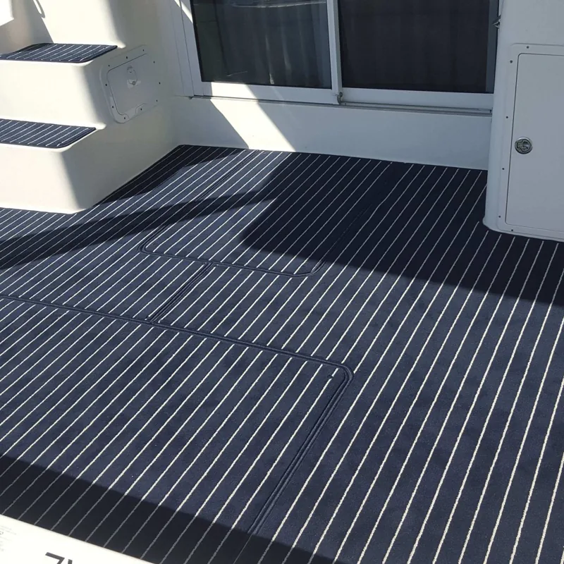 Dark blue marine flooring with thin white lines.