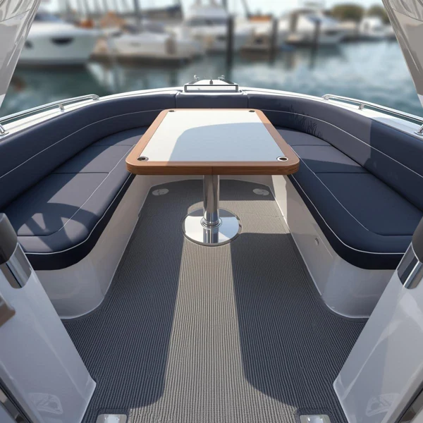 Grey ribbed olefin marine carpet installed on a boat deck with navy seating.