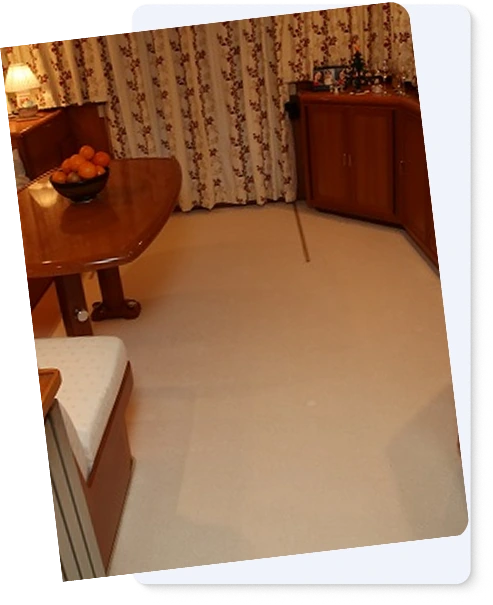Neutral plush marine carpet in a yacht interior with wood accents.