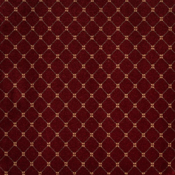 Red Trellis marine carpet with a gold diamond geometric pattern.