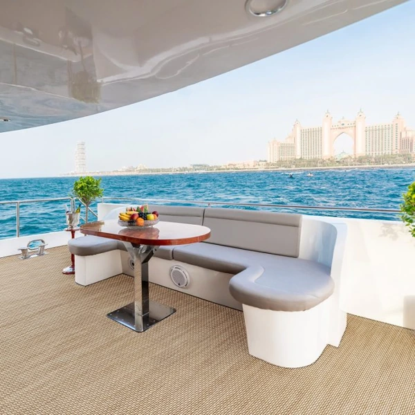 Tan woven marine carpet on a yacht deck with a view of Atlantis